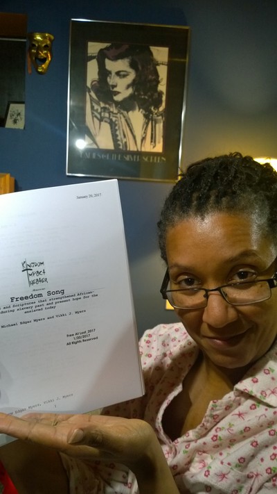 Actress holding theater script.
