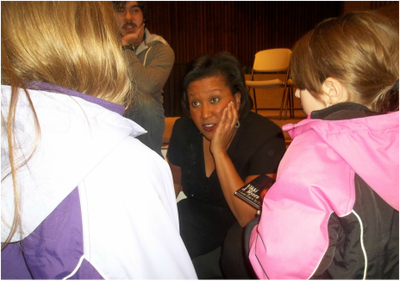 Woman teaching attentive students.